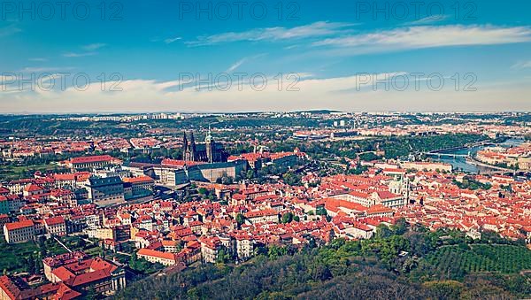 Vintage retro hipster style travel image of aerial panorama of Hradchany: the Saint Vitus
