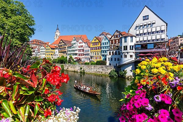 City on the Neckar River with punting boat in Tuebingen