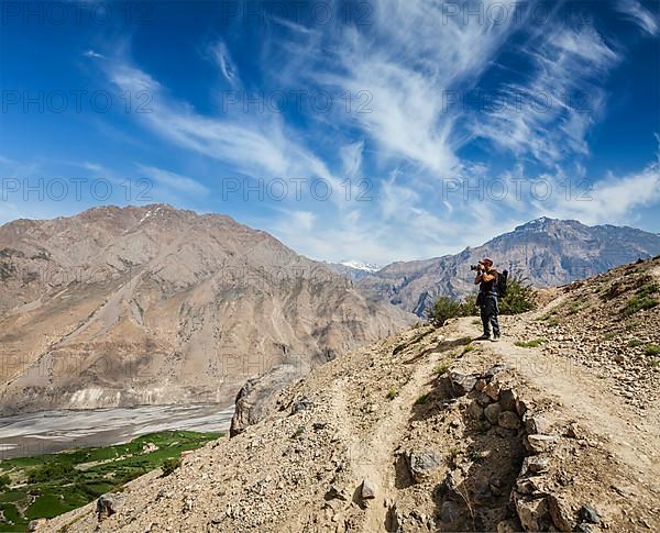 Photographer taking photos in Himalayas mountains. Spiti valley