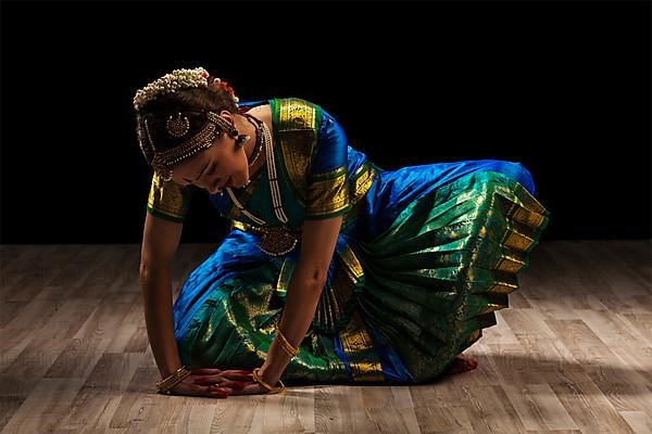 Young beautiful woman dancer exponent of Indian classical dance Bharatanatyam