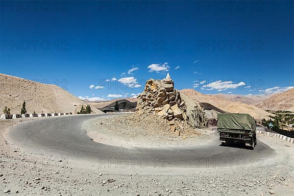 Road in Himalayas with army truck. Ladakh