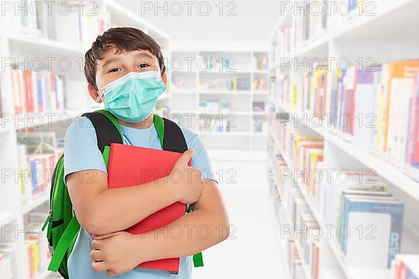 Young Pupil Child Boy at School with Mask against Corona Virus with Text Free Space Copyspace in Stuttgart
