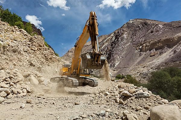 Excavator doing road construction in Himalayas. Ladakh