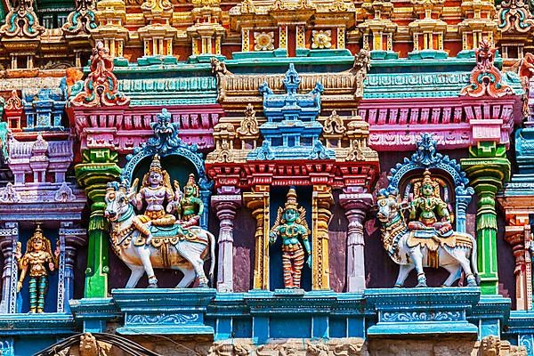 Shiva and Parvati on bull images. Sculptures on Hindu temple gopura tower. Meenakshi Temple