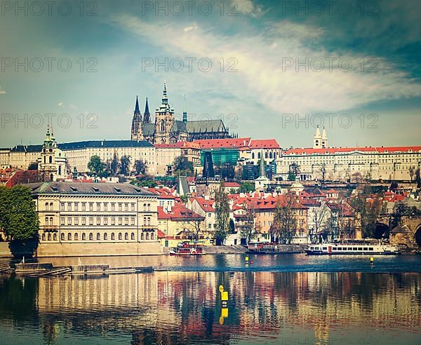 Vintage retro hipster style travel image of Charles bridge over Vltava river and Gradchany