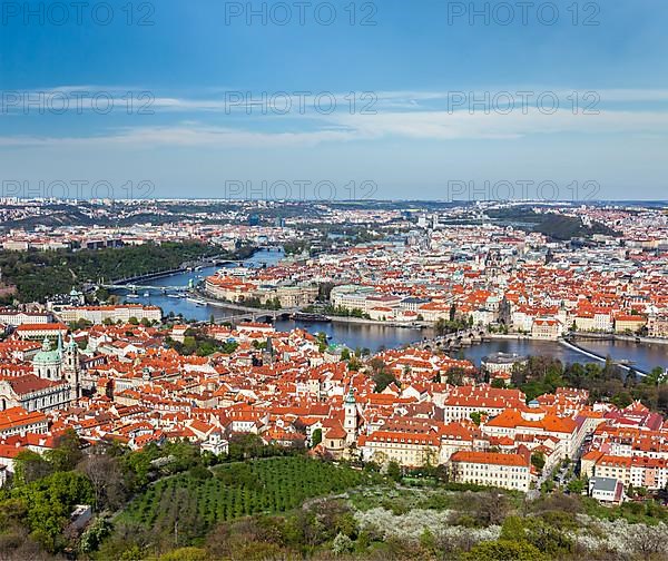 Aerial view of Charles Bridge over Vltava river and Old city from Petrin hill Observation Tower. Prague