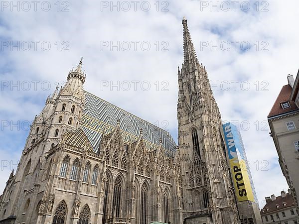 Poster against the war in Ukraine on the south tower of St. Stephen's Cathedral