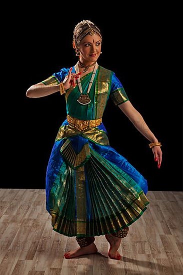 Young beautiful woman dancer exponent of Indian classical dance Bharatanatyam