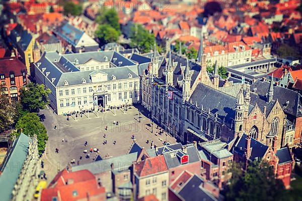 Vintage retro hipster style travel image of aerial view of the Burg square with the City Hall. Bruges