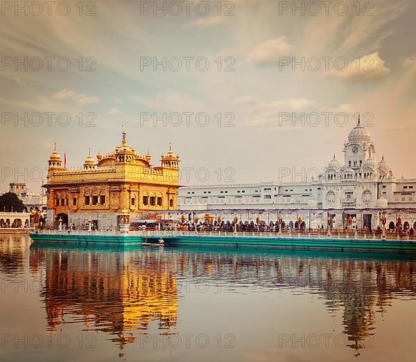 Vintage retro effect filtered hipster style travel image of Sikh gurdwara Golden Temple Harmandir Sahib. Amritsar