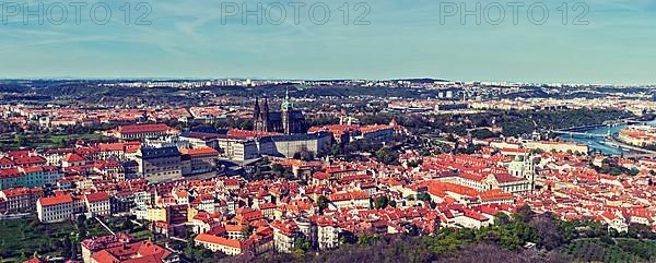 Vintage retro hipster style travel image of aerial panorama of Hradchany the Saint Vitus St. Vitt's Cathedral and Prague Castle. Prague