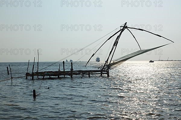 Kochi chineese fishnets on sunset. Fort Kochin