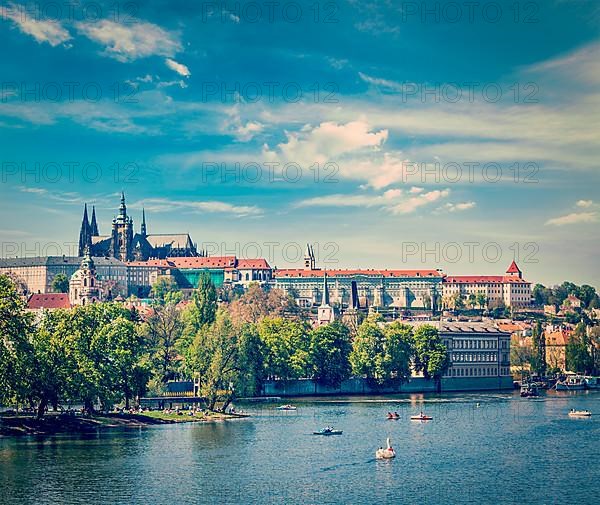 Vintage retro hipster style travel image of panorama view of Vltava river and Gradchany