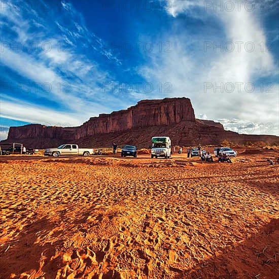 Car park with motorhome in red sand