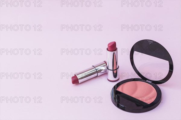 Two lipsticks pink blusher pink background. Resolution and high quality beautiful photo