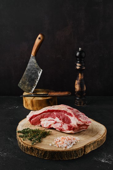 Raw beef brisket on wooden cutting board