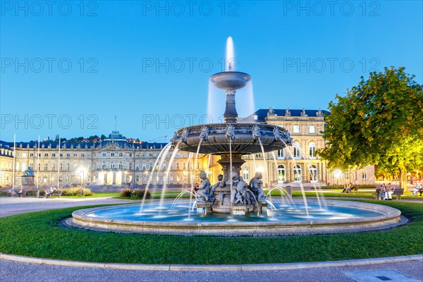 Schlossplatz with fountain and New Palace travelling blue hour in Stuttgart