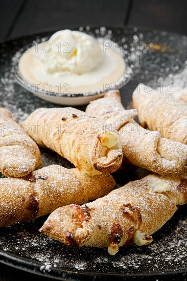 Closeup view of mini croissant with banana and pear with icecream