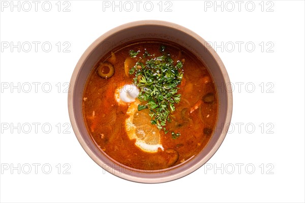 Traditional solyanka soup isolated on white