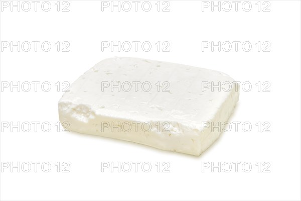 Piece of feta cheese isolated on white background