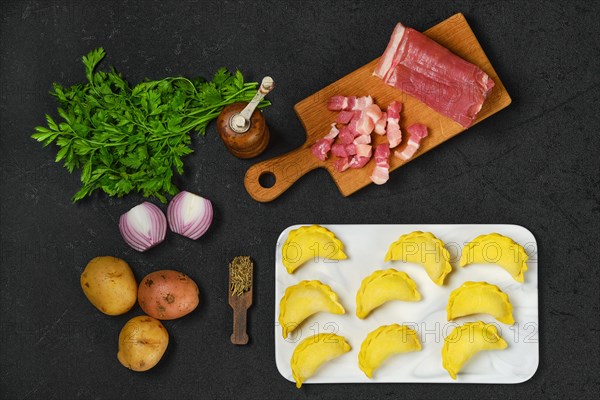 Top view of frozen dumplings with bacon and potato