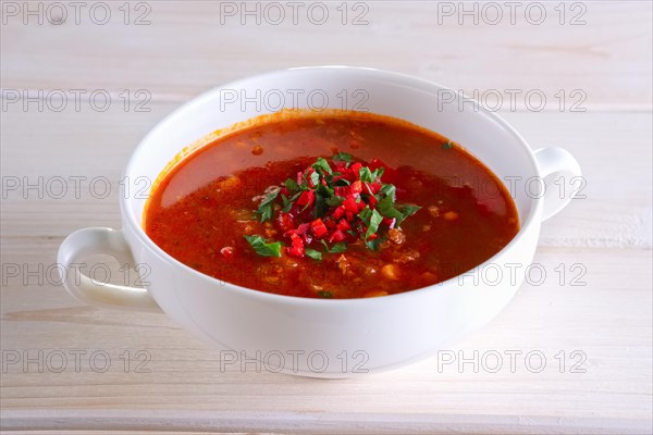 Plate of gazpacho on wooden table