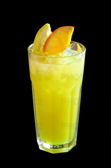 Glass of kiwi and lemon lemonade isolated on black