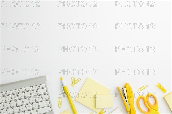 Flat lay stationary arrangement desk with yellow supplies