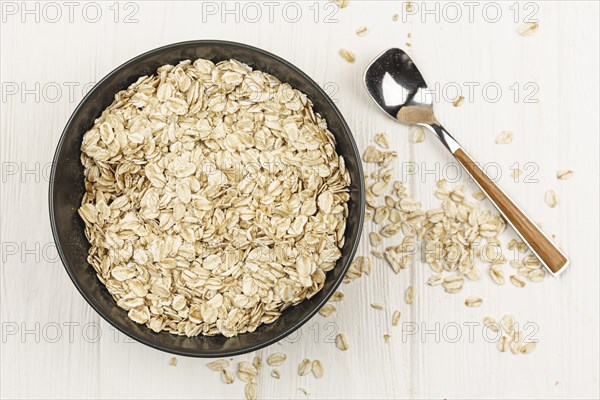 Oatmeal bowl with spoon on the table