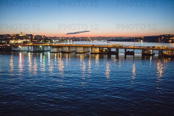 Ataturk bridge on Golden Horn at night on display