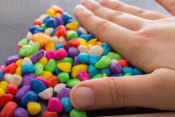 Pile of little colorful pebbles as stone background