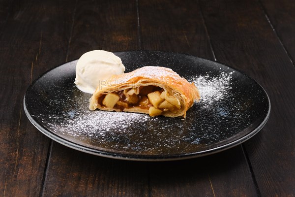 Piece of classic apple strudel on a plate