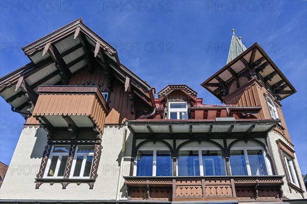 Classic timber building with wooden shingle facade