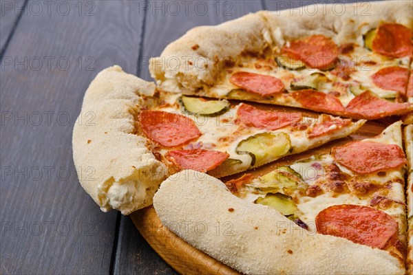 Close up view of slice of pizza pepperoni with cheese crust