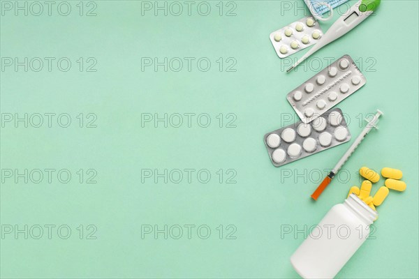 Pills medical tools green surface with space text 1