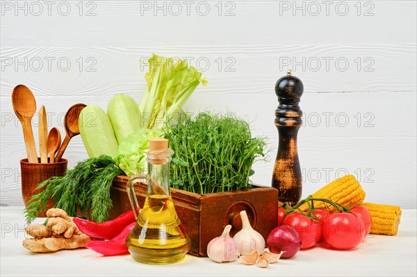 Wooden table with fresh eco vegetables and herbs. World vegan day concept with copy space for text