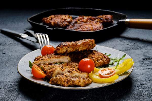 Pork chop fillet baked in oven with seasoning and herbs