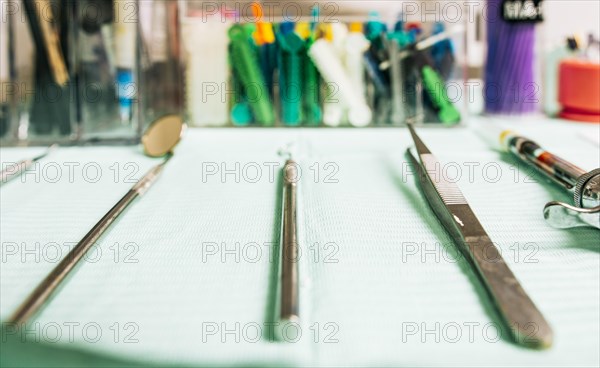 Stomatologist tools close-up on table. Set of dental tools on dentist's panel. Close up of dental tools on dentist's table