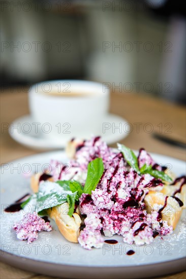 Warm waffles with cottage cheese and currant jam