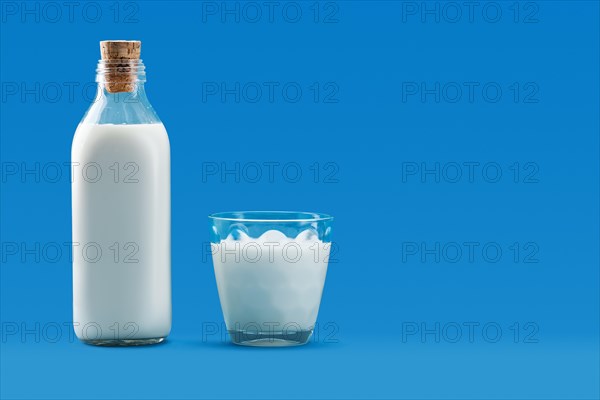 Open bottle and a glass of milk