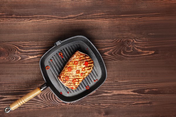 Grilled meat on cast iron skillet