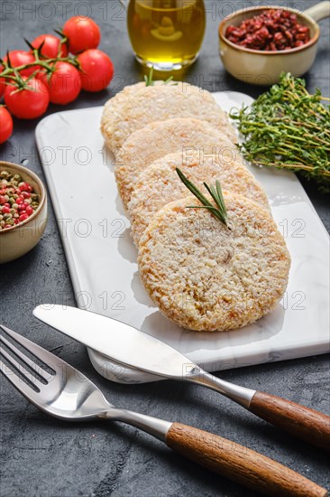 Semifinished chicken cutlet in breading ready for frying