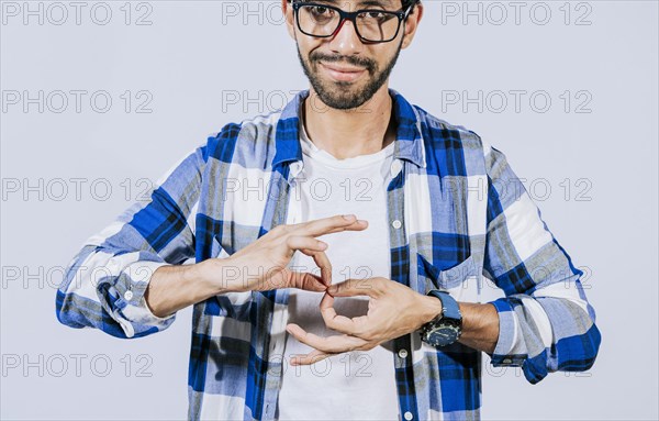 Man speaking in sign language. Manual gestures of people with hearing problems. Person speaking in sign language. Deaf and dumb people speaking in sign language