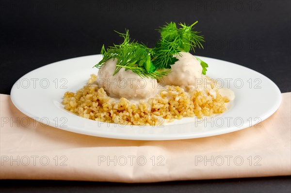 Plate with meatballs and bulgur