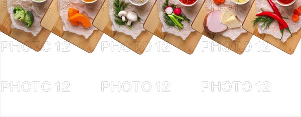 Variety of colorful vegetables and ingredients for cream soups top view isolated on white