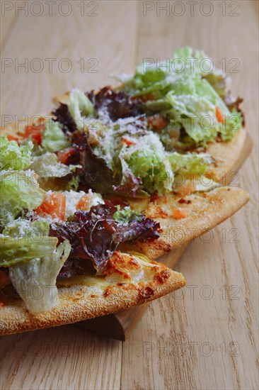 Freshly baked focaccia with salad leaves