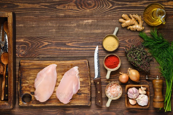 Culinary concept. Wooden background with chicken fillet