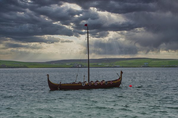 Old viking boat before the seafront of Lerwick