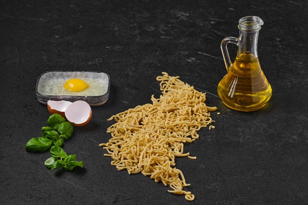 Composition with homemade noodles on kitchen table