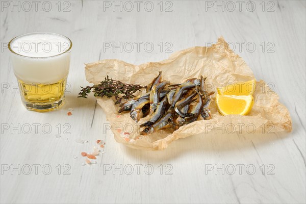 Fatty smoked smelt in wrapping paper